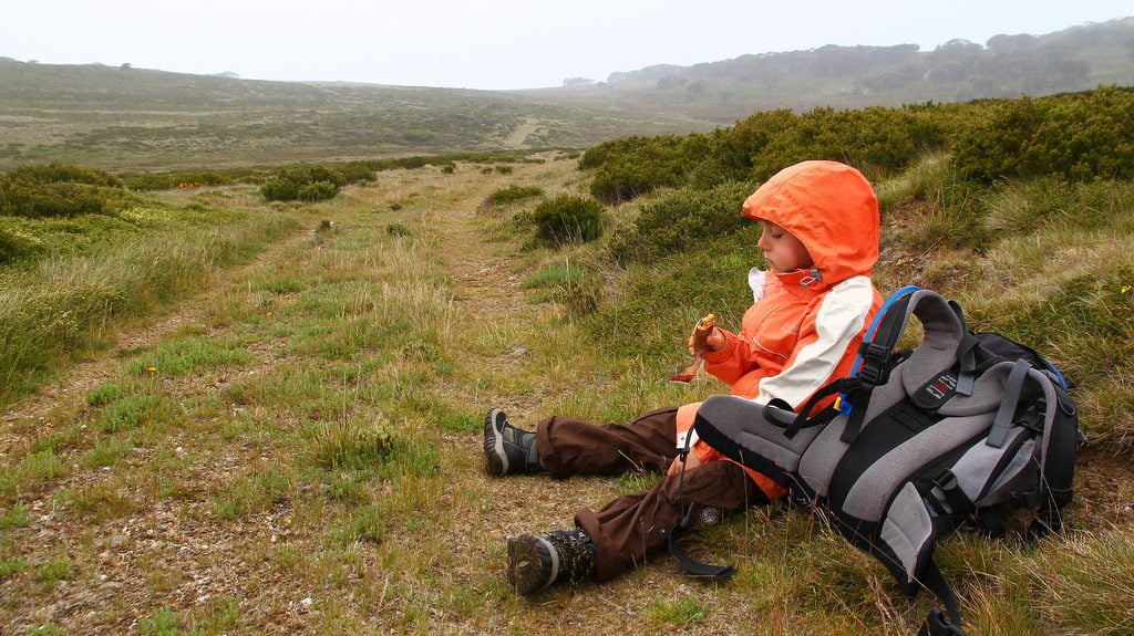 Tobiash resting and refueling energy with a muesli bar.