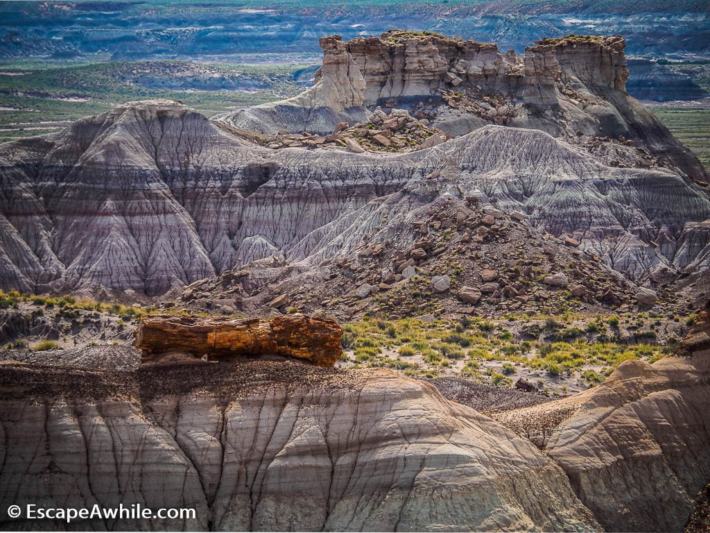 Blue Mesa, an ancient mud eroded in colourful layers.  A hard stone  log had capped the hill and prevented it to erode away completely. 